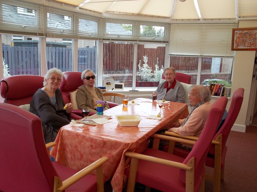 A group of elderly women from St David's Bradbury Day Centre in Edinburgh sat around a table