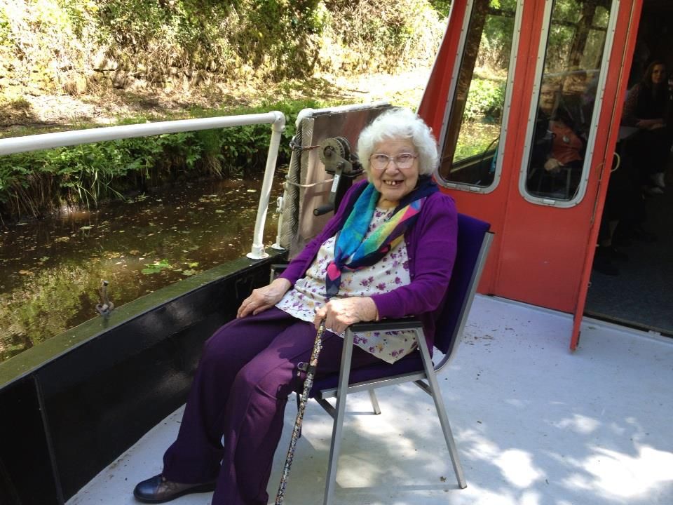An elderly pensioner from St David's Bradbury Day Centre in Edinburgh sitting on a canal barge