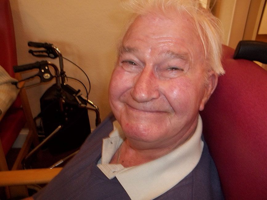 A pensioner from St David's Bradbury Day Centre in Edinburgh smiling at the camera