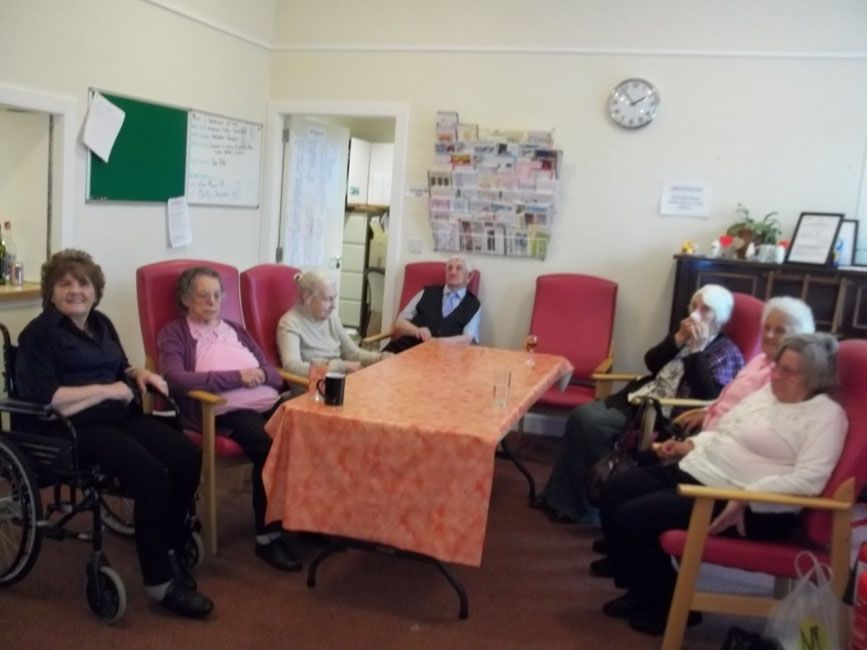 A group of elderly from St David's Bradbury Day Centre in Edinburgh sat in a circle in a social setting